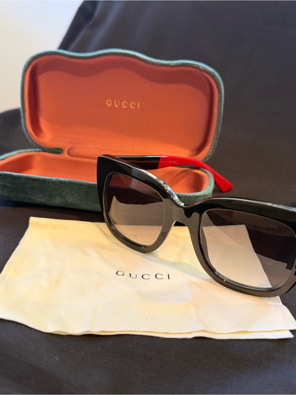 Gucci Black Cat-Eye Sunglasses with Red Temples